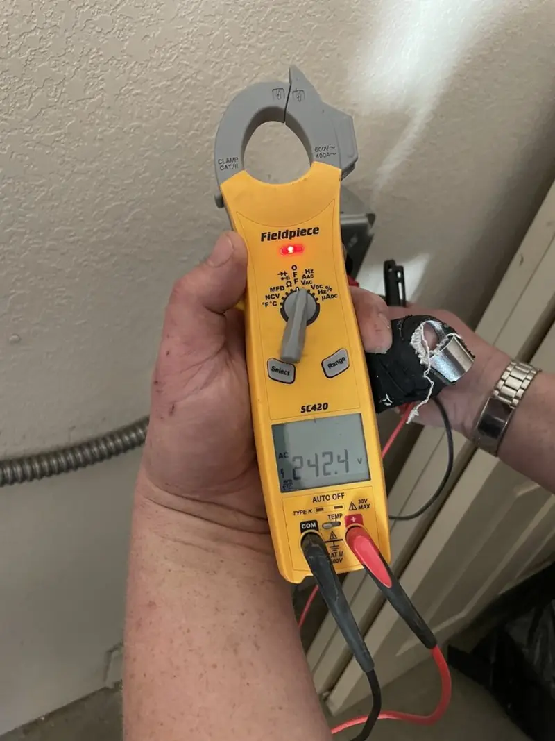 Voltage testing with clamp meter during Circuit Breaker Repair in Greenville